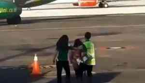 Viral Video: OMG! Woman missed her flight, tries to chase down moving plane