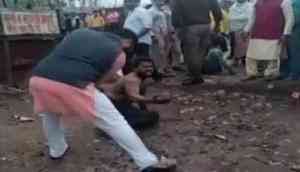 Caught on Camera: AAP lawmaker's aide mercilessly thrashes a man on Delhi's busy road; policemen watch
