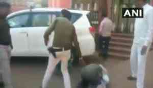Watch: Farmer in Madhya Pradesh's Shivpuri cries, falls down on the feet of District Collector to fulfill his demand
