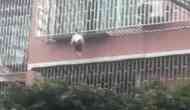 Scary Video: Girl trapped between railings by neck, dangles from third floor balcony and....!
