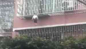 Scary Video: Girl trapped between railings by neck, dangles from third floor balcony and....!