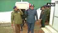 Pulwama Attack: Rajnath Singh lends shoulder to mortal remains of a CRPF soldier in wreath laying ceremony