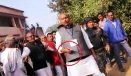 Watch: Jharkhand Polls; Congress' KN Tripathi brandishes pistol after scuffle breaks out with BJP