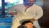 Saif Ali Khan turns hairstylist for son Taimur; see pic