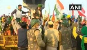 Farmers break police barricade at Tikri border, tractor rally enters Delhi