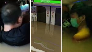 Disturbing Pics China Floods: 12 dead in Zhengzhou train as rainfall floods underground railway tunnels