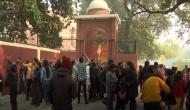 COVID-19 pandemic: Delhi's Sacred Heart Cathedral remains close, people light candles at back gate