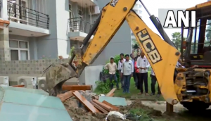 UP: Bulldozers demolish illegal construction at home of man who misbehaved with woman at Noida society